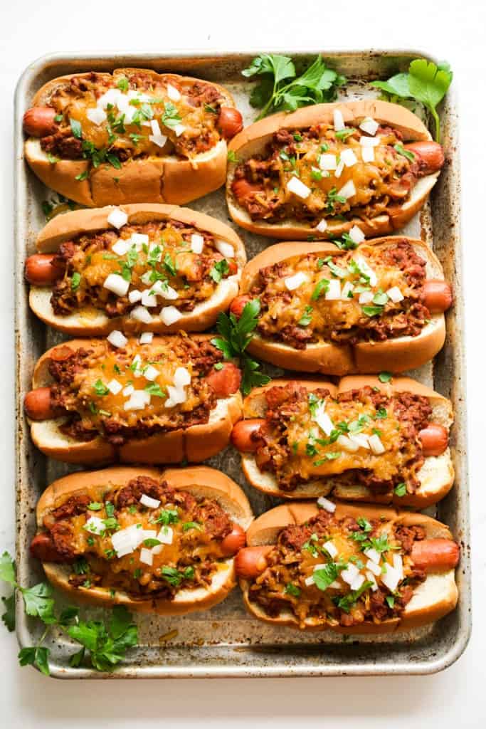 Top down view of a rectangular pan of chili cheese dog