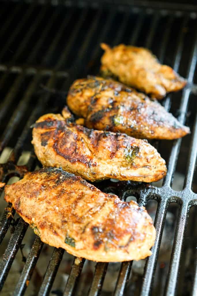 Grilling chicken breast on the grill