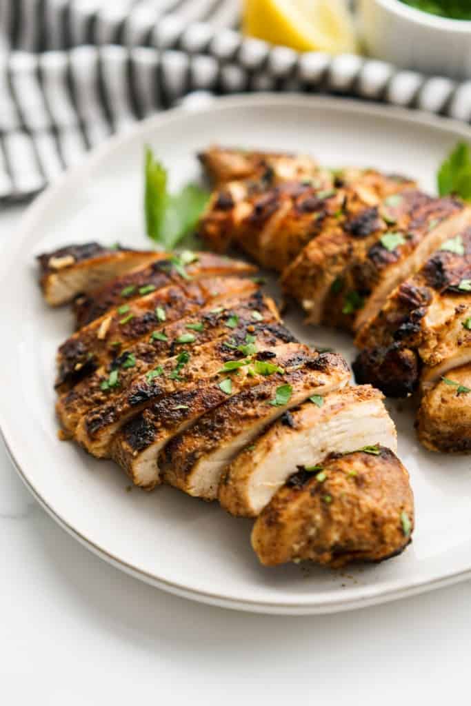 Sliced grilled chicken on a plate