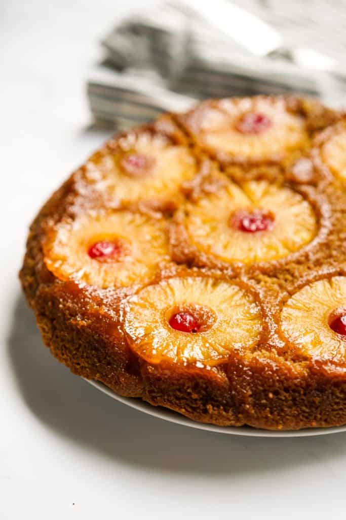 Pineapple upside down cake with pineapple rings and cherries on top