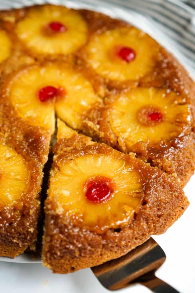 Removing a slice of pineapple upside down cake 