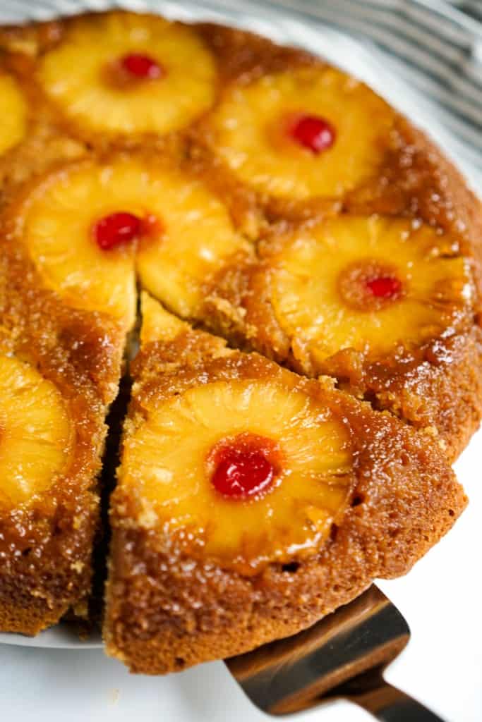 Removing a slice of pineapple upside down cake 