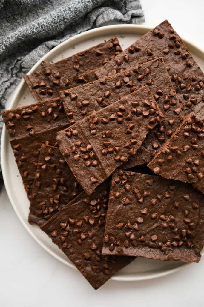Thin brownie crisp piled onto a round plate