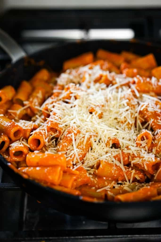 Spicy rigatoni vodka topped with grated parmesan cheese