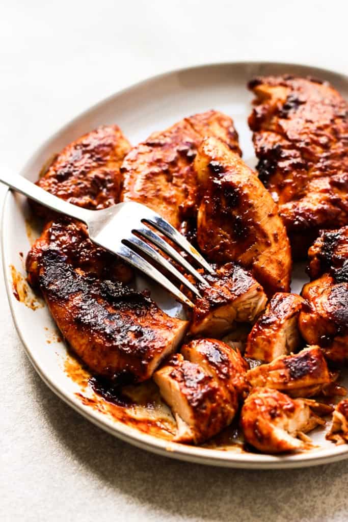 Barbecue chicken tenderloins on a plate