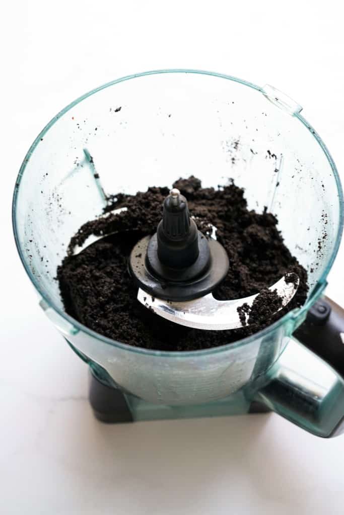 Oreo cookie crumbs in a food processor
