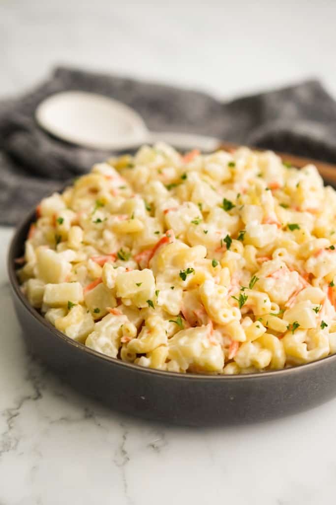 A bowl loaded with creamy potato macaroni salad