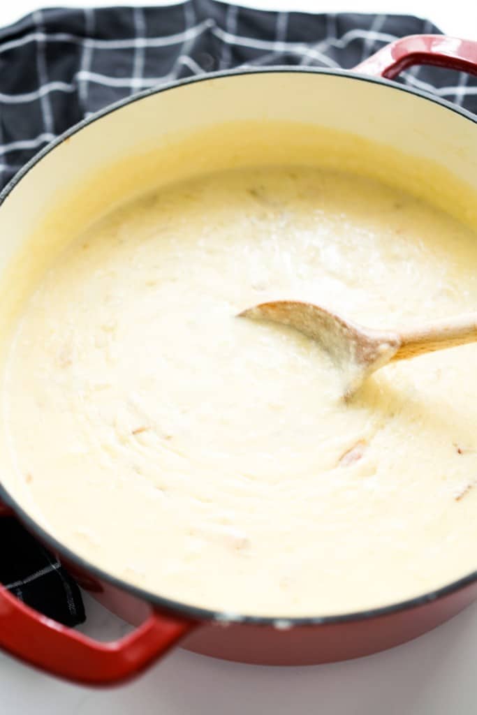 A large pot of creamy and thick potato soup