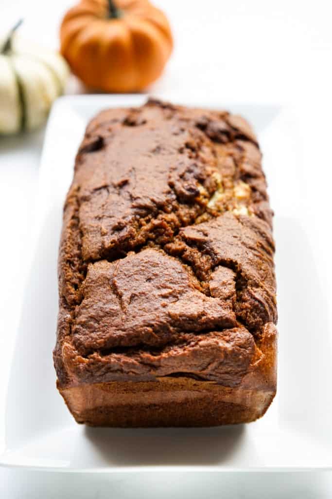 A loaf of pumpkin cream cheese bread fresh off the oven