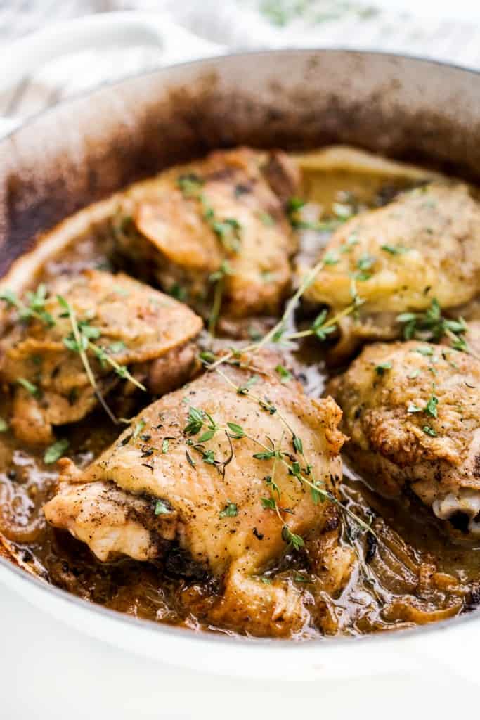 Braised chicken thighs in a Dutch oven braiser