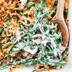 Creamy fresh green beans topped with crispy onions in a casserole dish