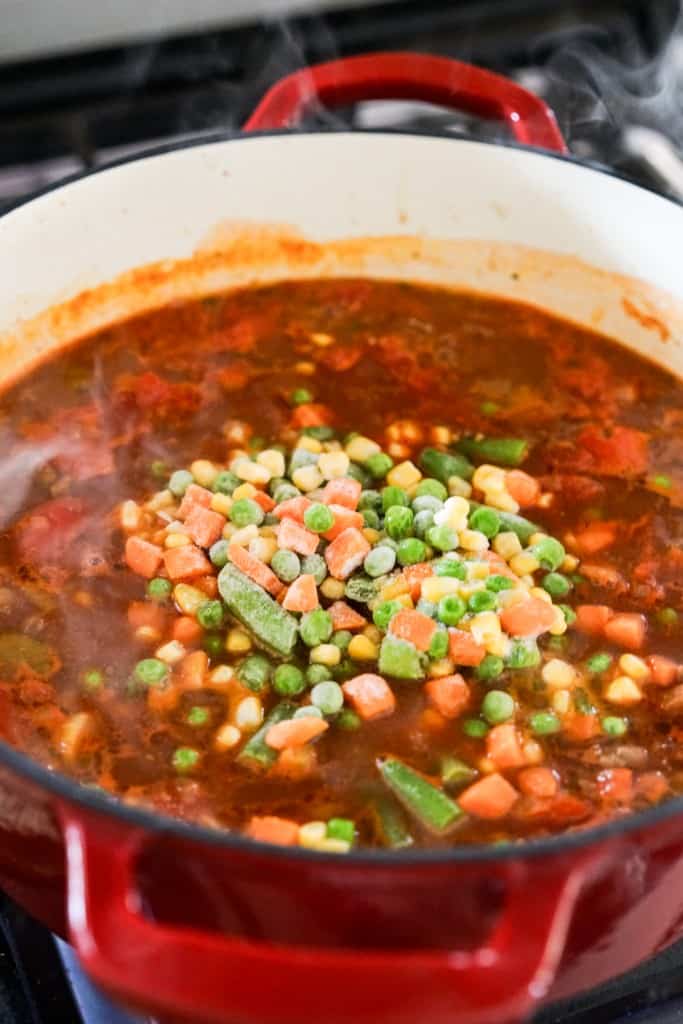 frozen vegetables added to pot of soup