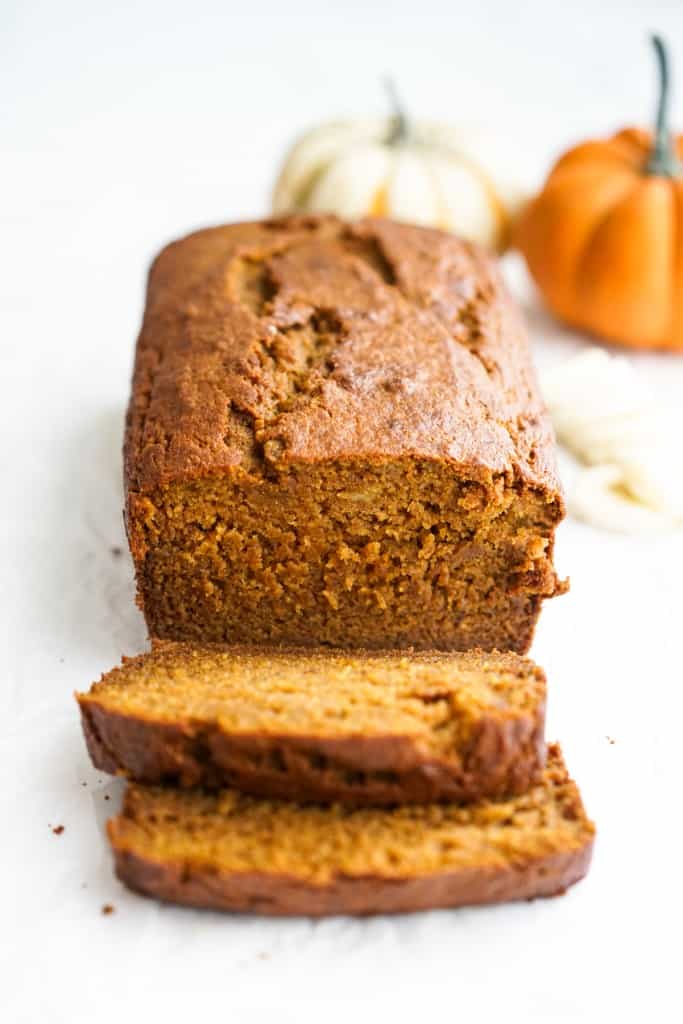 Slices of pumpkin banana bread from a loaf