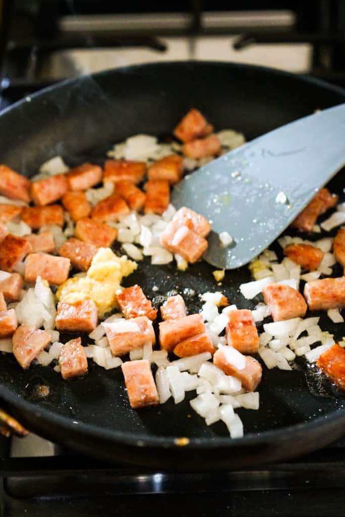 Stir frying spam, onions and garlic 