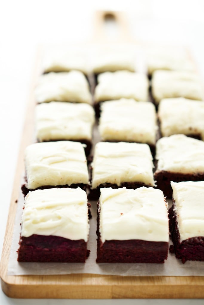Square slices of brownies on a wooden serving board