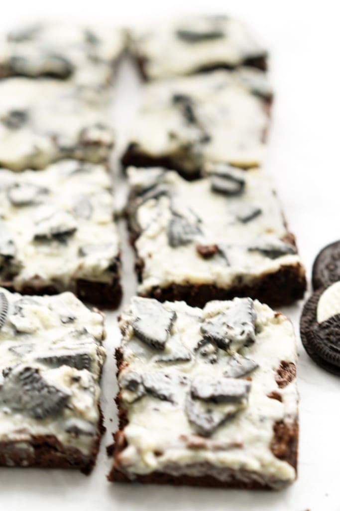 Square pieces of oreo brownies topped with Oreo icing