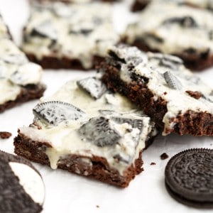 Brownies topped with Oreo cookies and white icing
