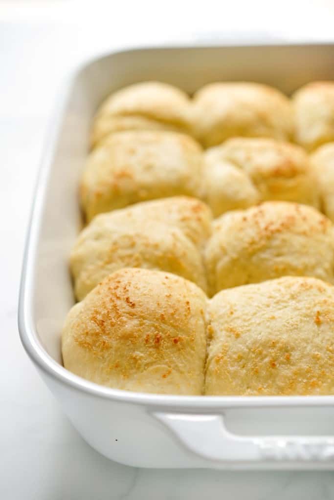 Soft and fluffy stuffed rolls freshly baked in a rectangular baking dish