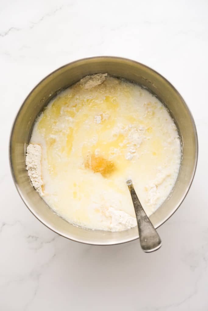 Melted butter, milk, egg, and vanilla added to the dry mixture in a mixing bowl. 