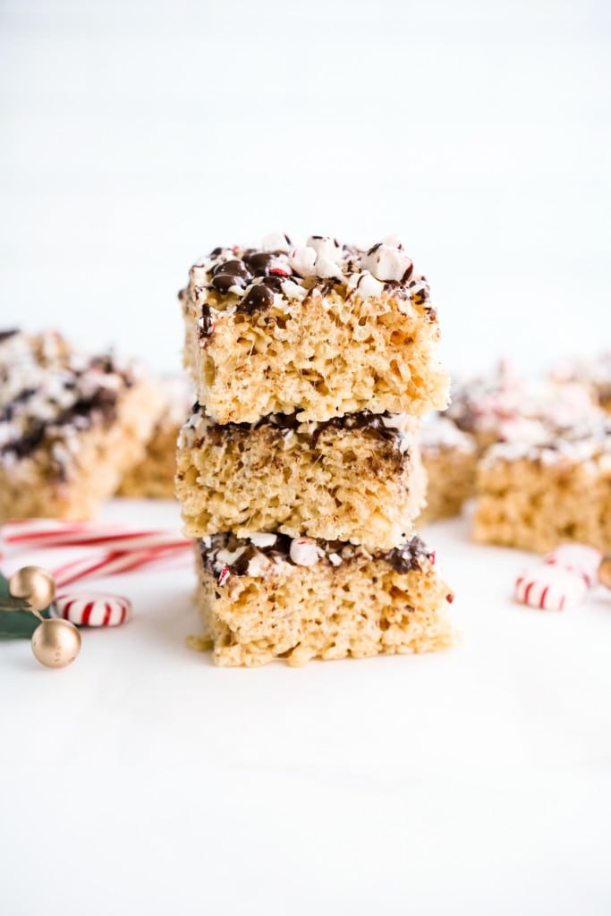 A stack of rice krispie treats topped with crushed peppermint