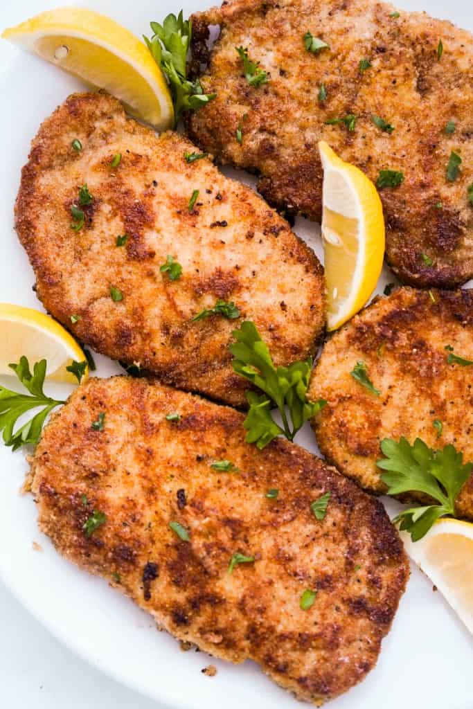 Closeup of a few pieces of parmesan crusted pork chops
