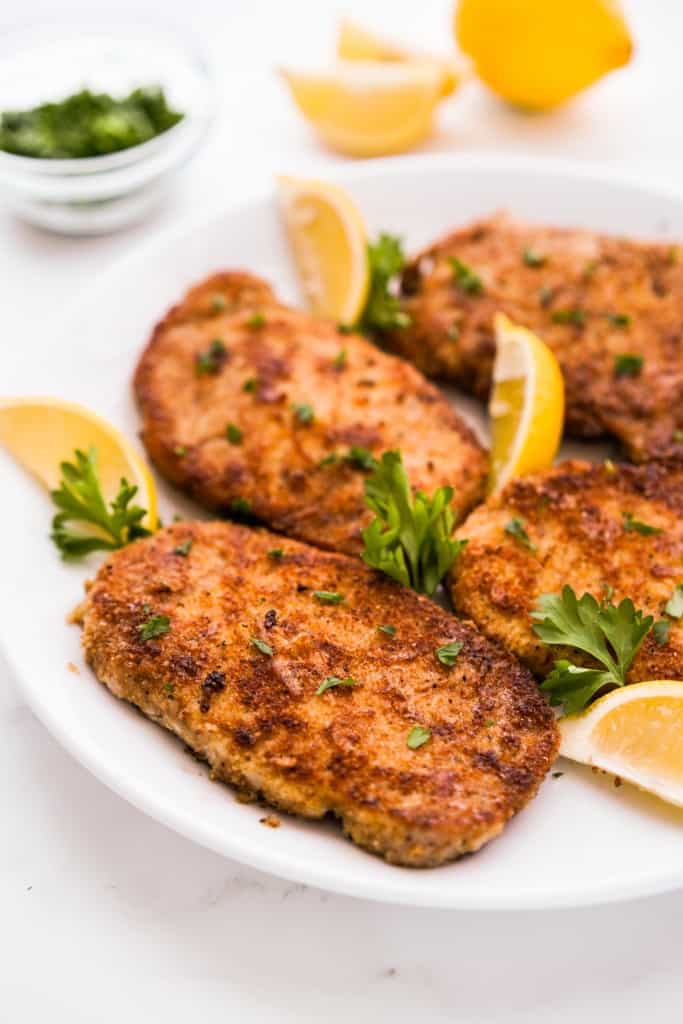 A plate of pork chops coated in crispy breading