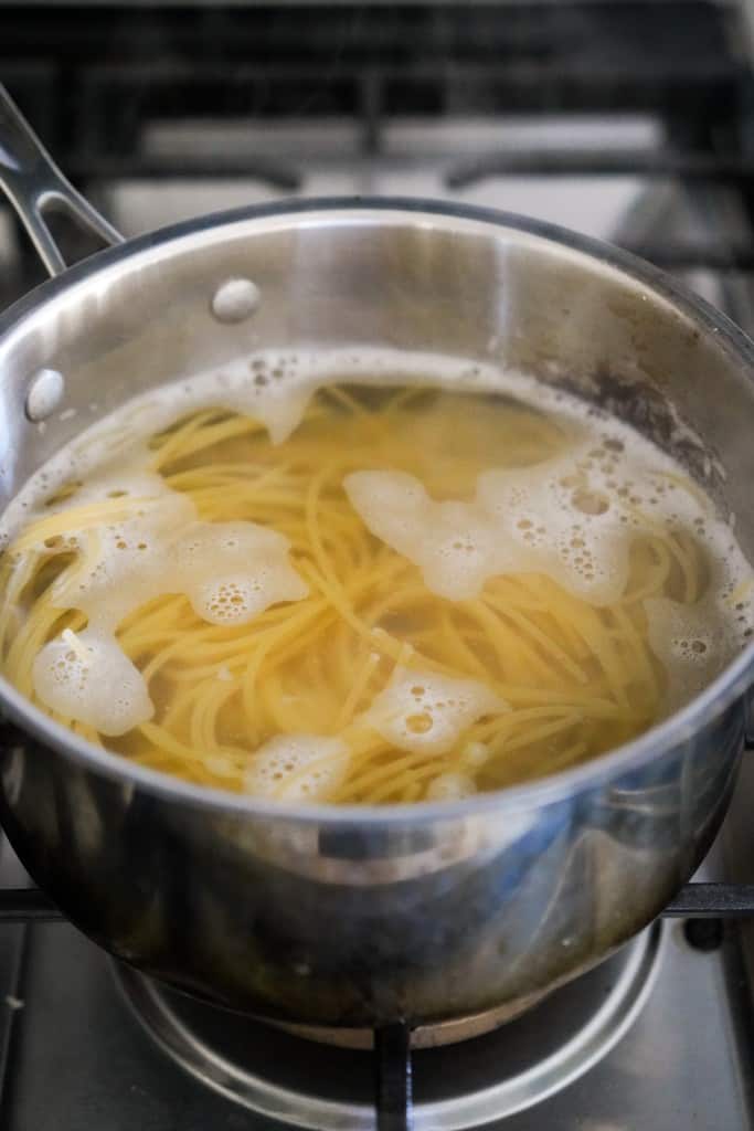 Boiling spaghetti in water in a pot