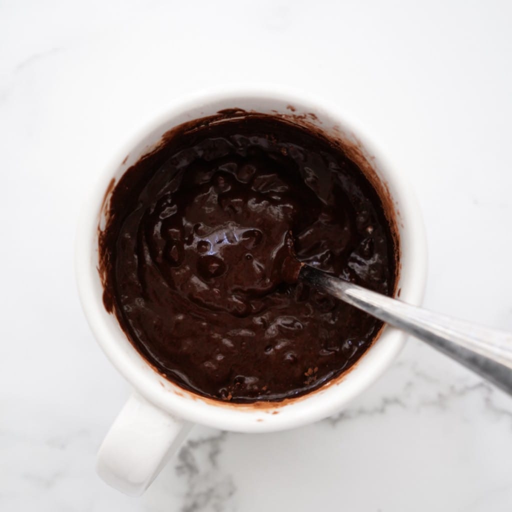 Chocolate mug cake prior to being cooked in microwave