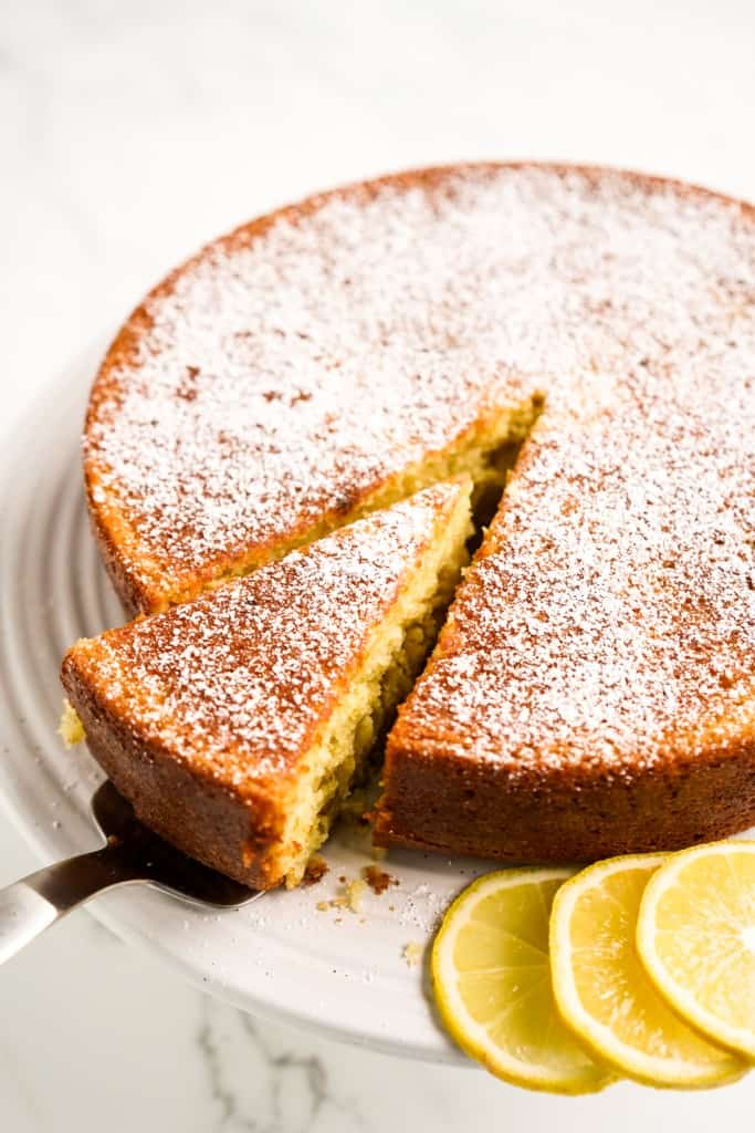 Removing a slice of olive oil cake 