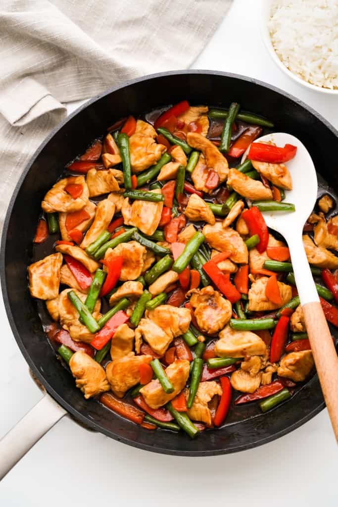 Teriyaki chicken stir fried with red bell peppers, green beans and carrots