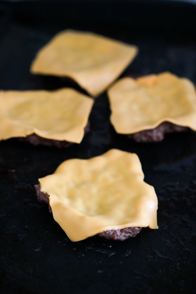 Melted cheese on burger patties