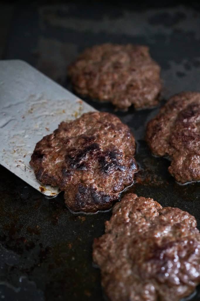 Caramelized burger patties with crispy edges