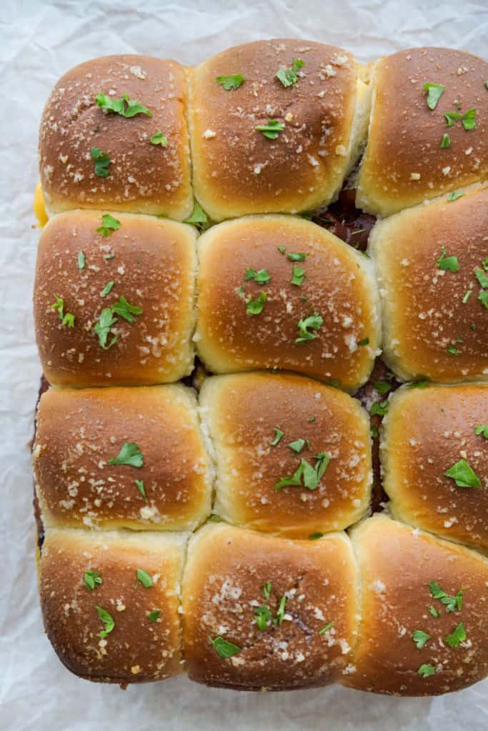 Top down view of Hawaiian roll breakfast sliders still joined together prior to cutting