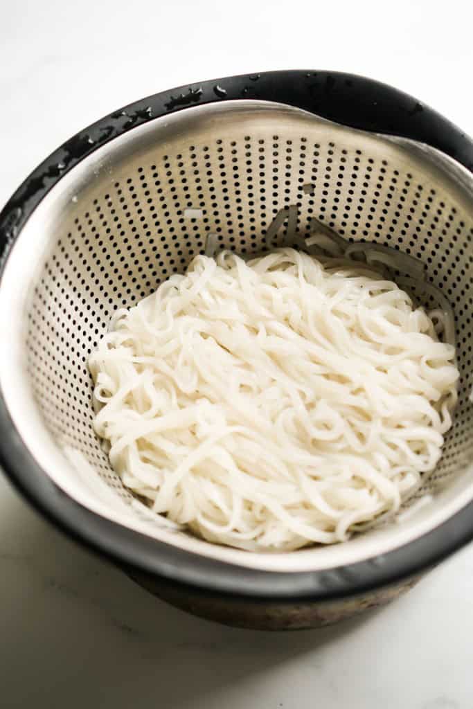 Rice noodles in colander