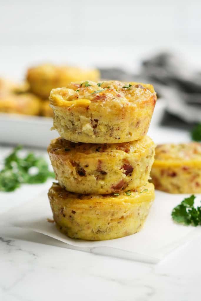 A stack of egg bites with bacon