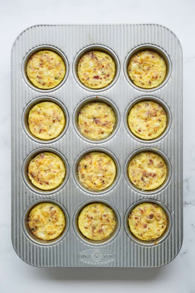 Baked egg bites with bacon and cottage cheese in muffin tin