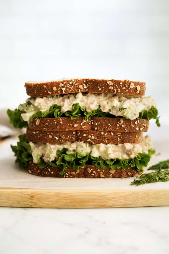 Two tuna egg salad sandwich piled on top of each other