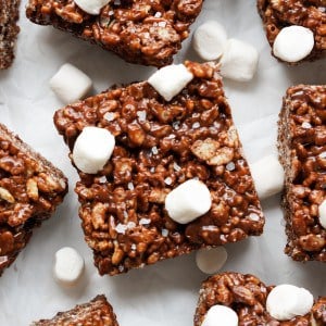 Square piece of chocolate rice krispie treats with mini marshmallows and sea salt flakes