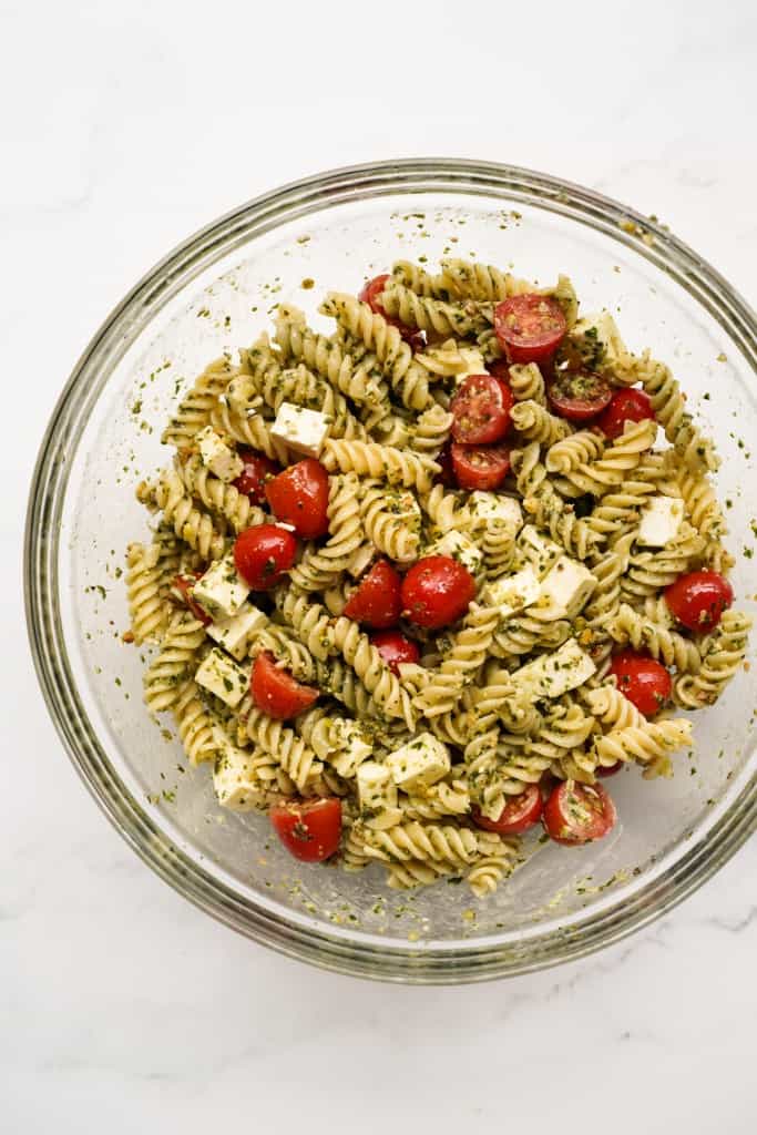 Fusilli pasta, cherry tomatoes and feta coated in pesto mayo