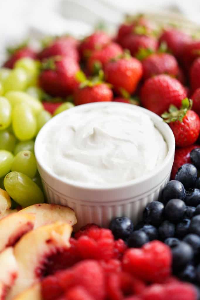 Closeup of a bowl of fluffy fruit dip made with marshmallow fluff