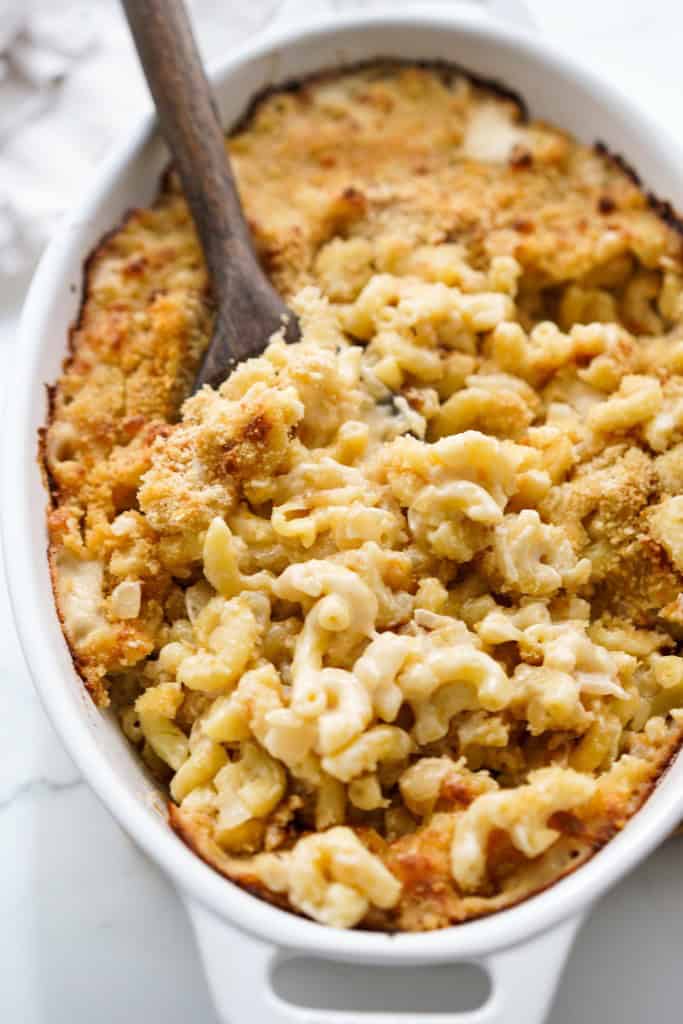 Digging into a gooey casserole of macaroni and cheese with French onion
