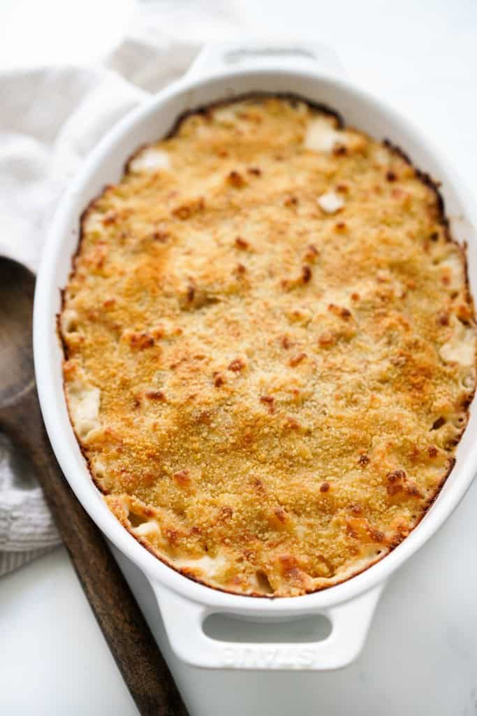 Golden brown breadcrumb topping in a oval mac and cheese baker
