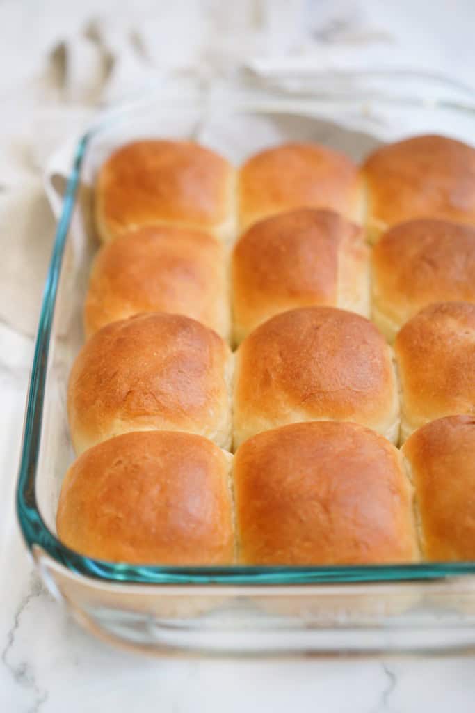 Milk bread rolls in a transparent baking dish