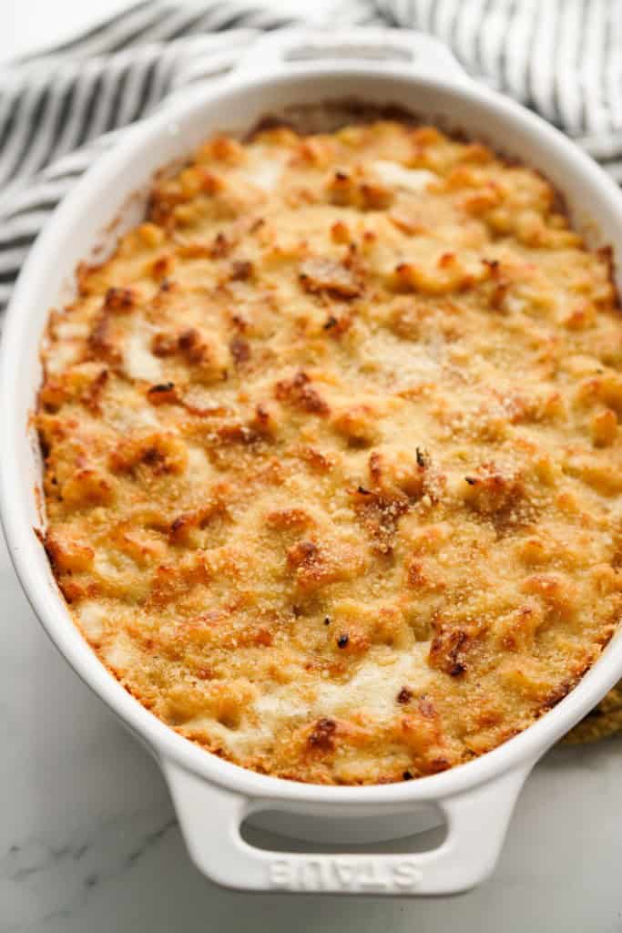 Freshly baked casserole dish loaded with mac and cheese with crusty tops