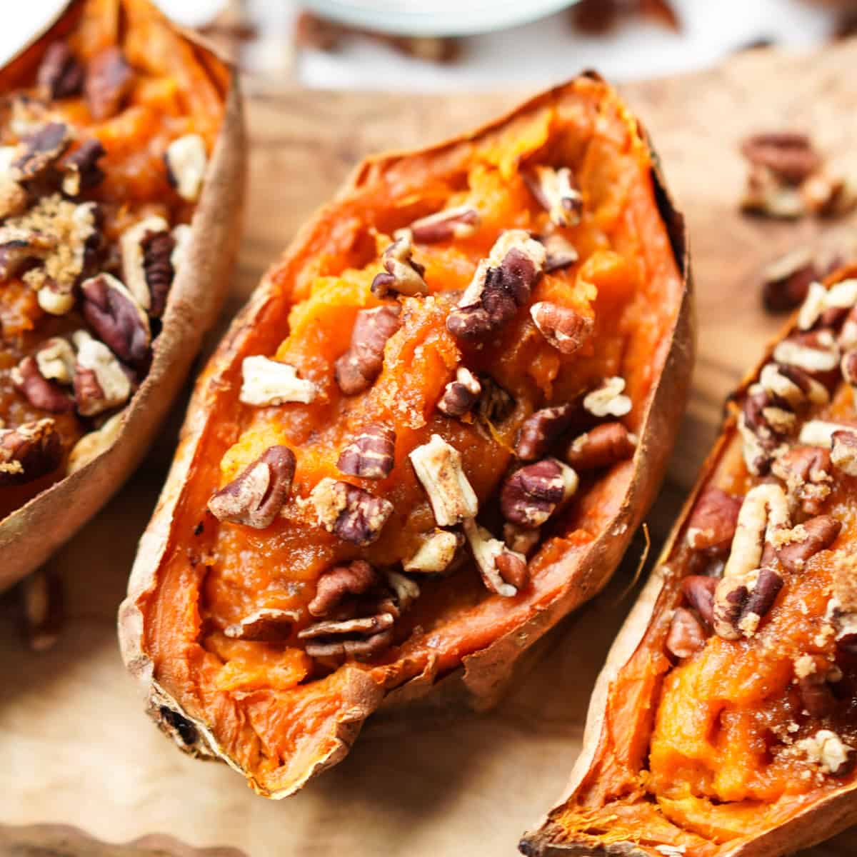 Close up of twice baked sweet potatoes topped with pecan brown sugar mixture