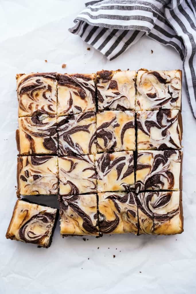 Cheesecake brownies with marble top cut into smaller squares
