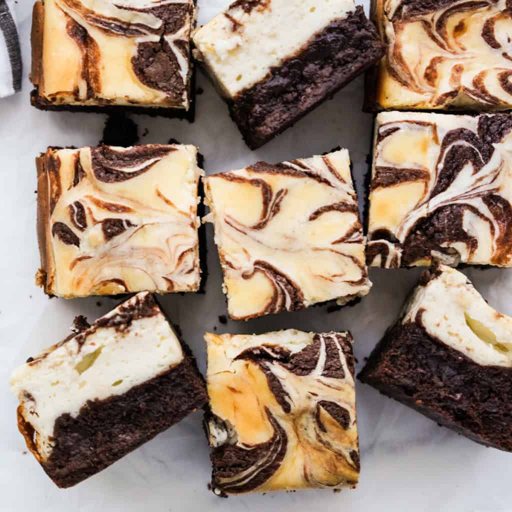 Square slices of cheesecake brownies with a marble swirl
