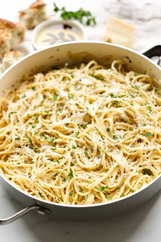 A large deep skillet filled with spaghetti