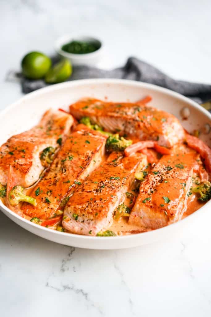 Thai red curry salmon in a large skillet