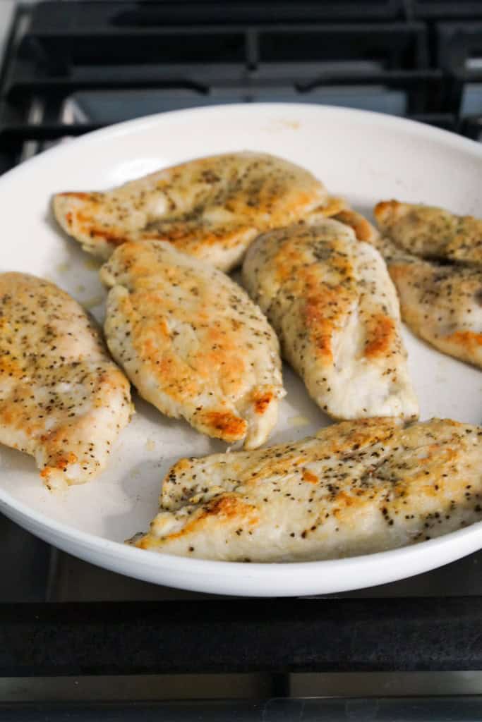 Searing chicken breast in skillet